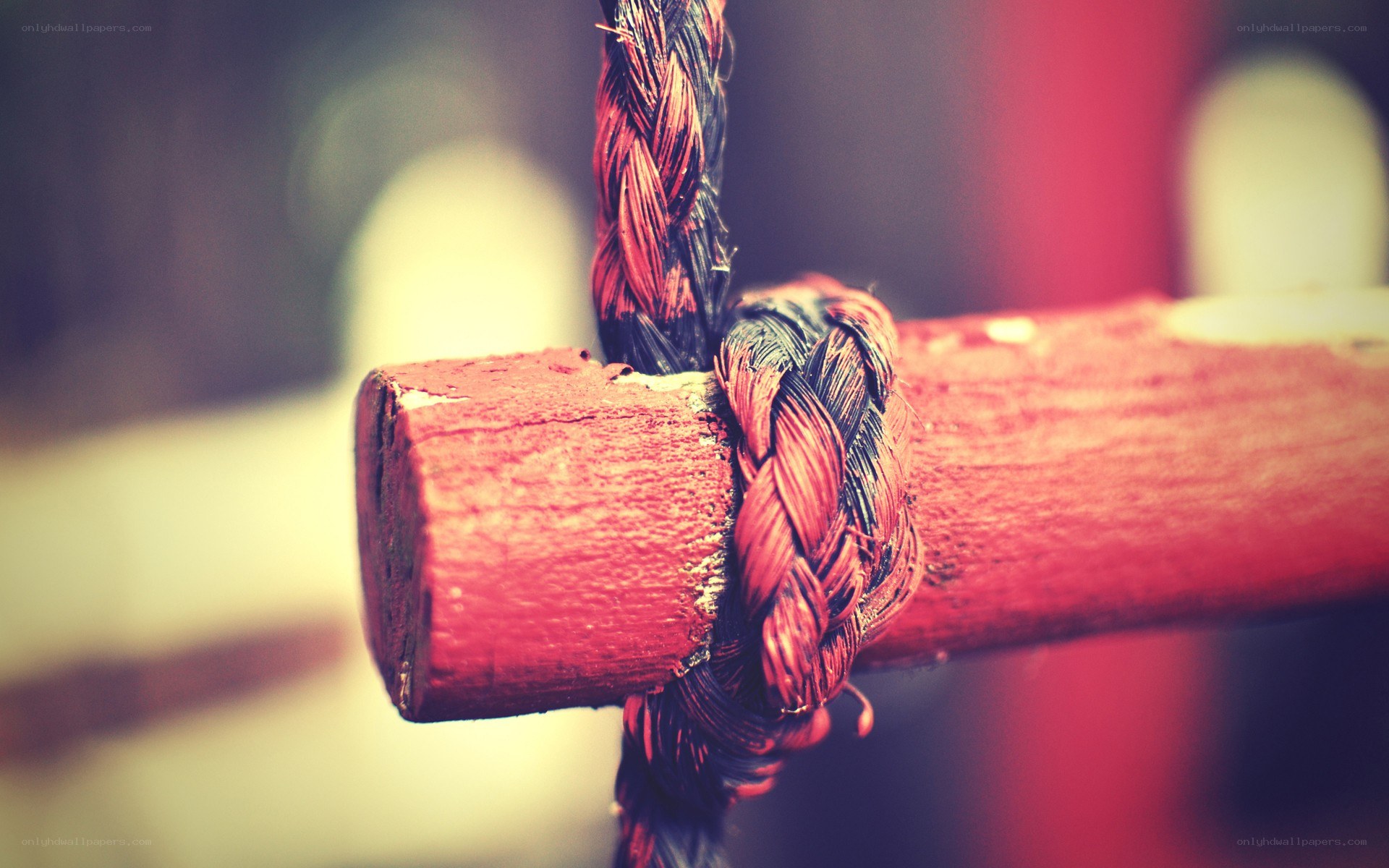 Braided rope on wooden beam