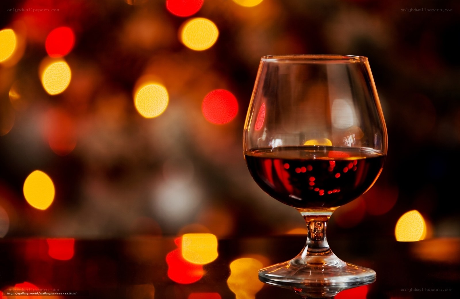 Brandy glass with bokeh lights