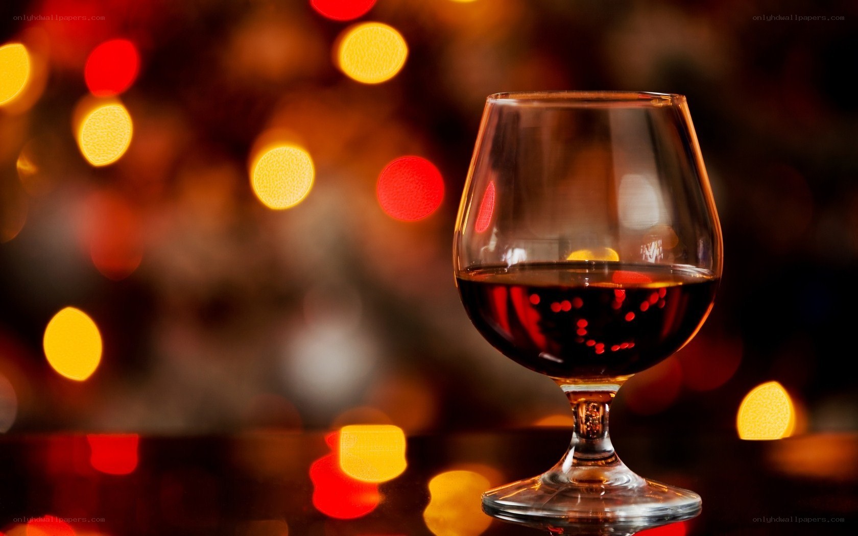 Brandy in a glass with bokeh lights