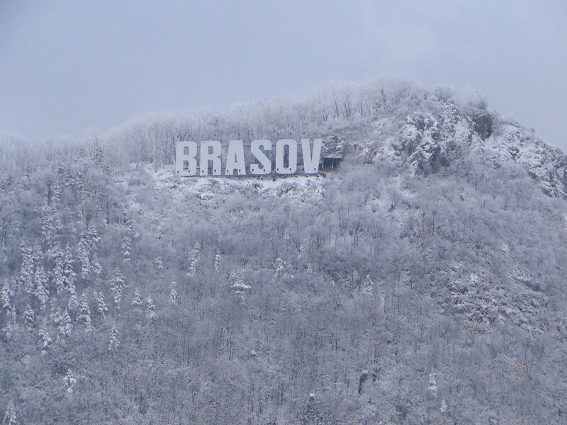 Brasov sign on snowy mountain