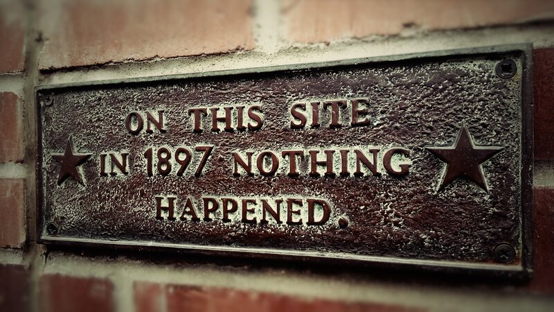 Brass Plaque on Brick Wall