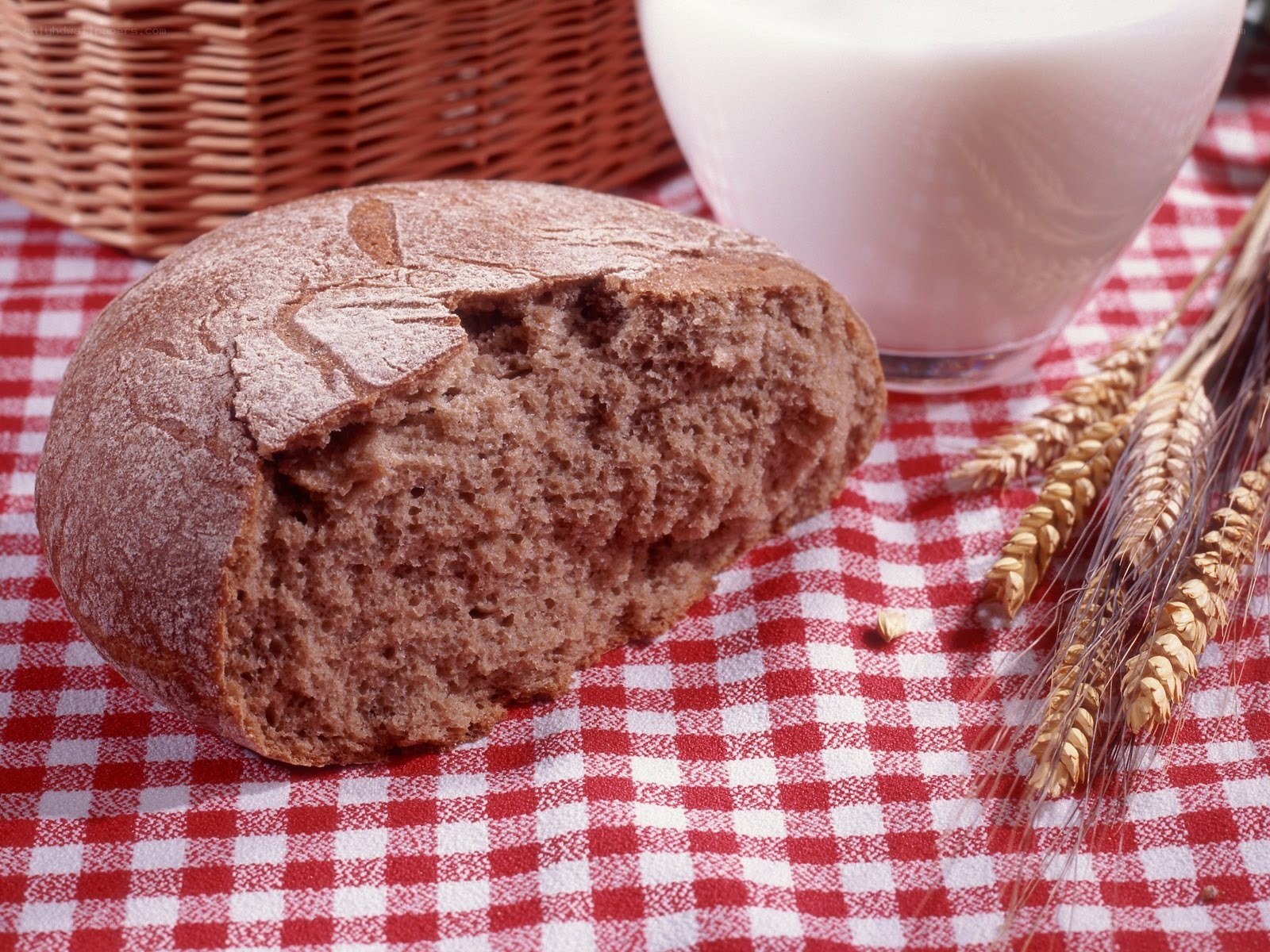 Bread and milk on checkered cloth