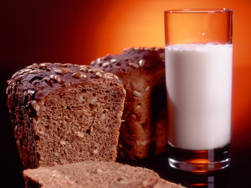 bread and milk on warm background