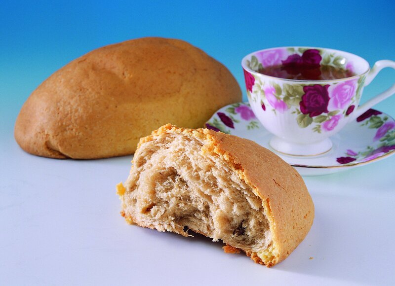 Bread and tea on blue