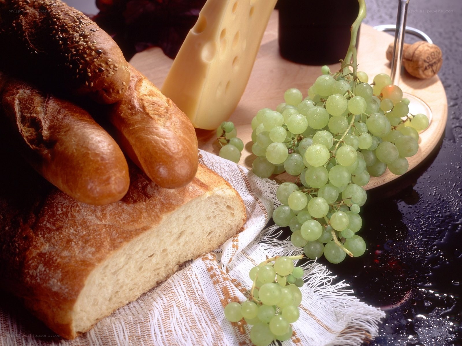 Bread, cheese, and grapes