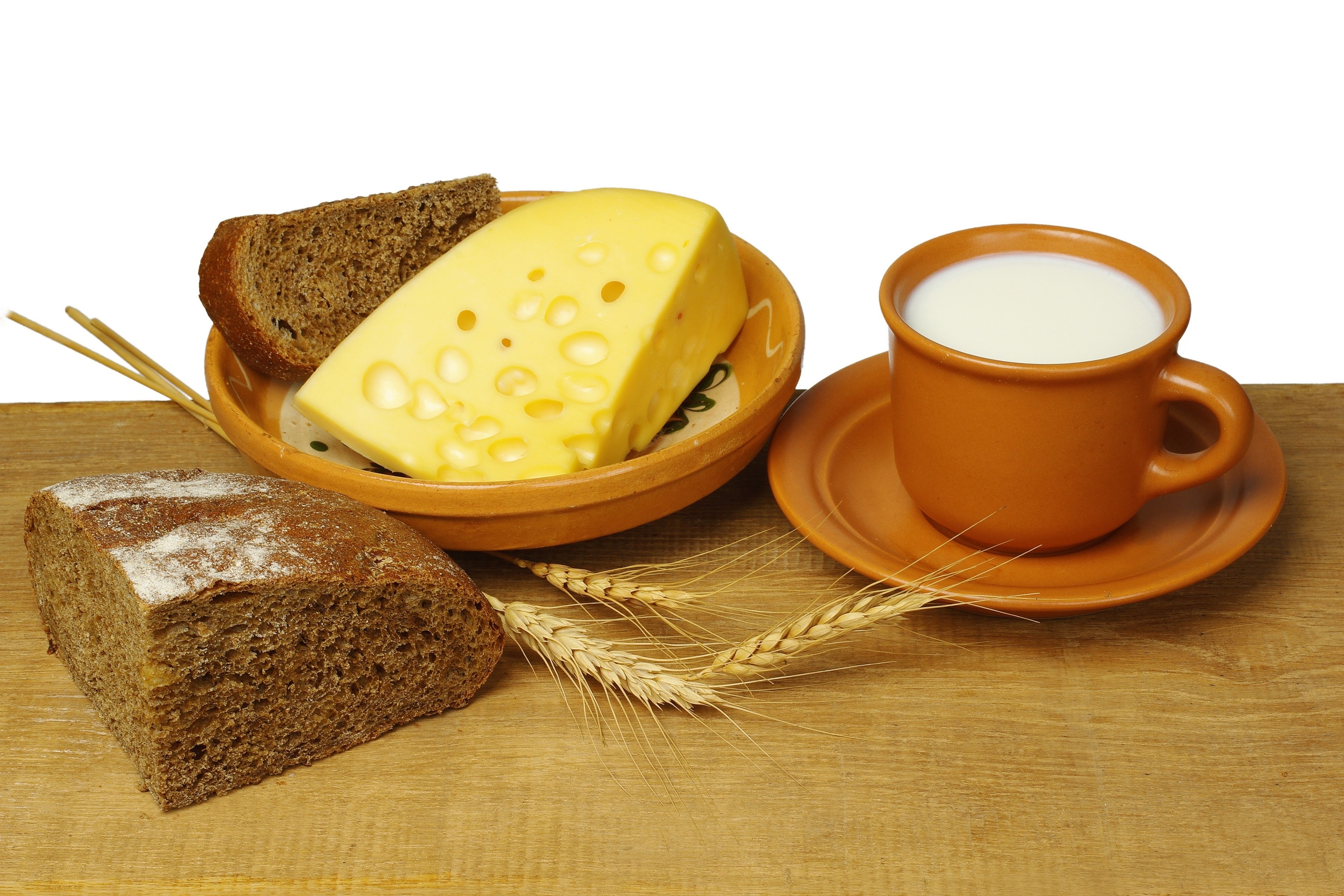 bread cheese and milk on wood