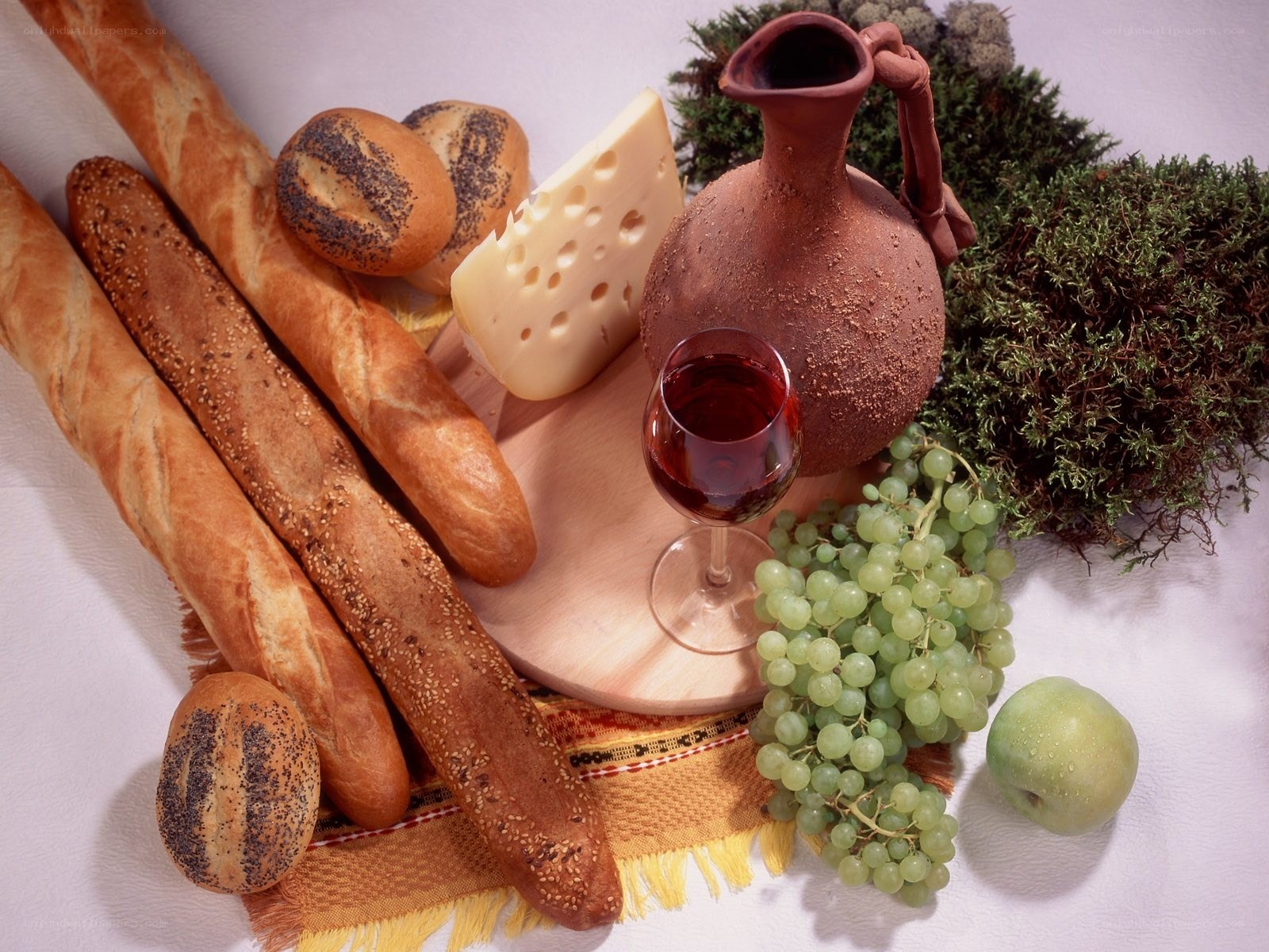 Bread, cheese, and wine arrangement