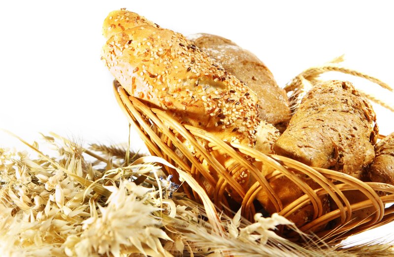 Bread in a basket with wheat