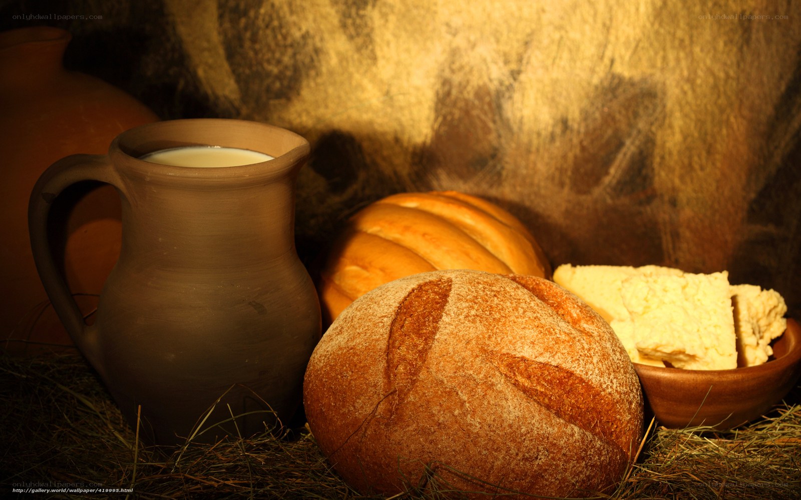 Bread, milk, and butter on hay