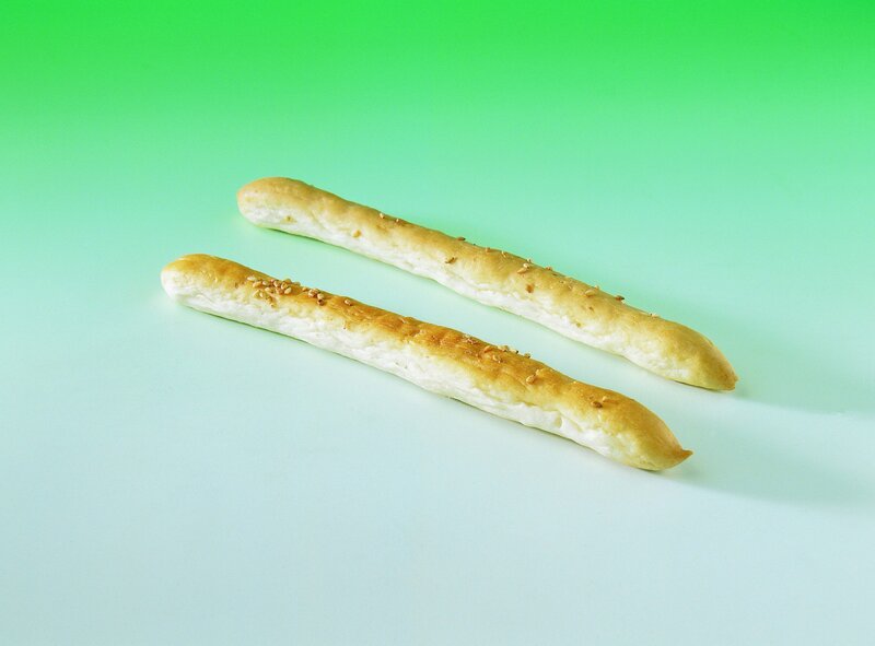breadsticks on green background