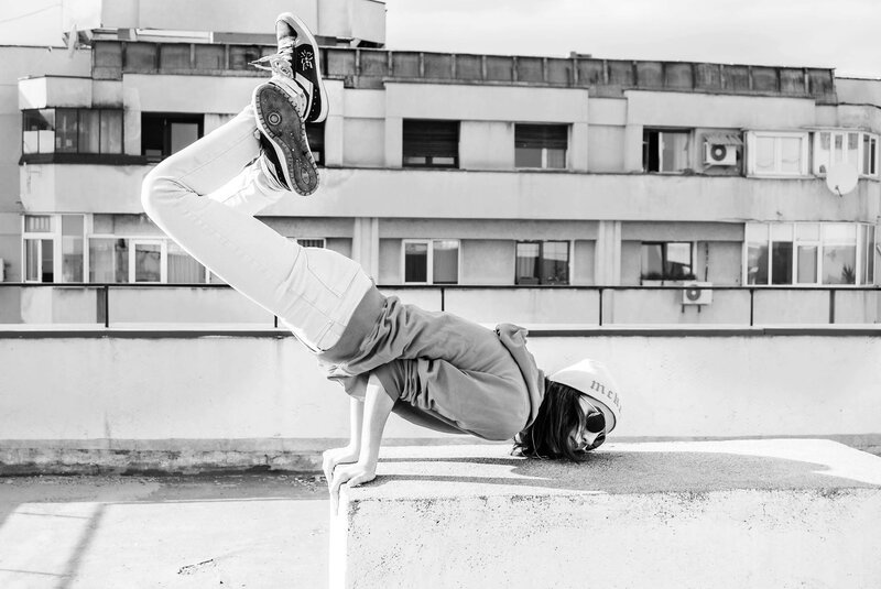 Breakdancer on rooftop