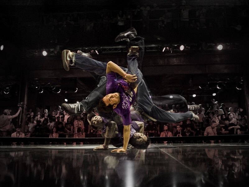 Breakdancer Performing Move — Black, Dynamic, Night, Photograph