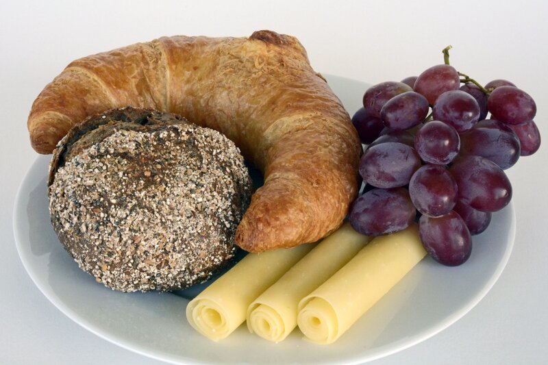 Breakfast plate with croissant and fruit