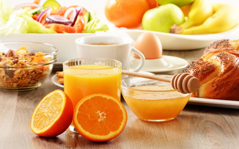 Breakfast Spread on Table — Orange