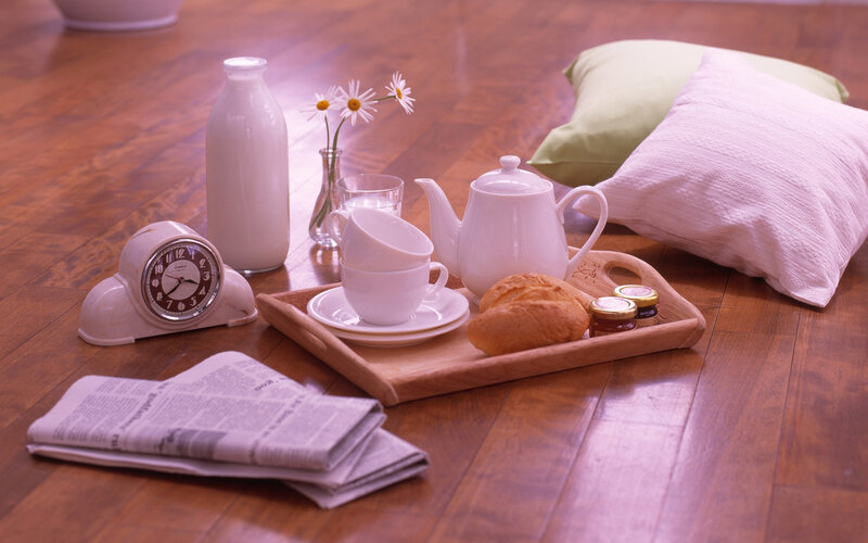 Breakfast tray on wooden floor