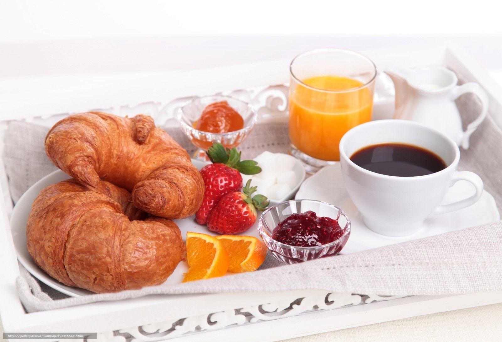 Breakfast tray with croissants and fruit