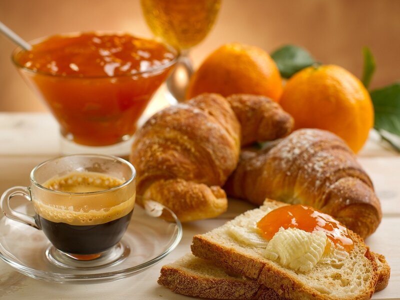 Breakfast with coffee and croissants