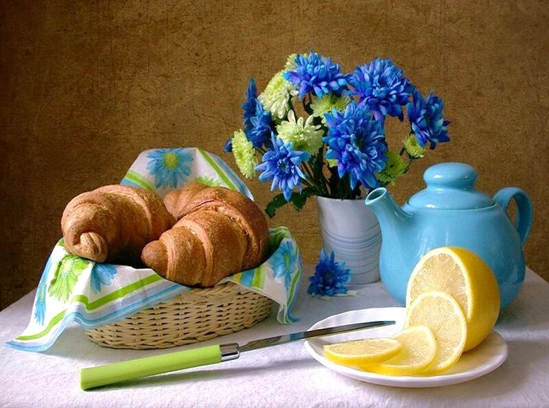 Breakfast with croissants and flowers