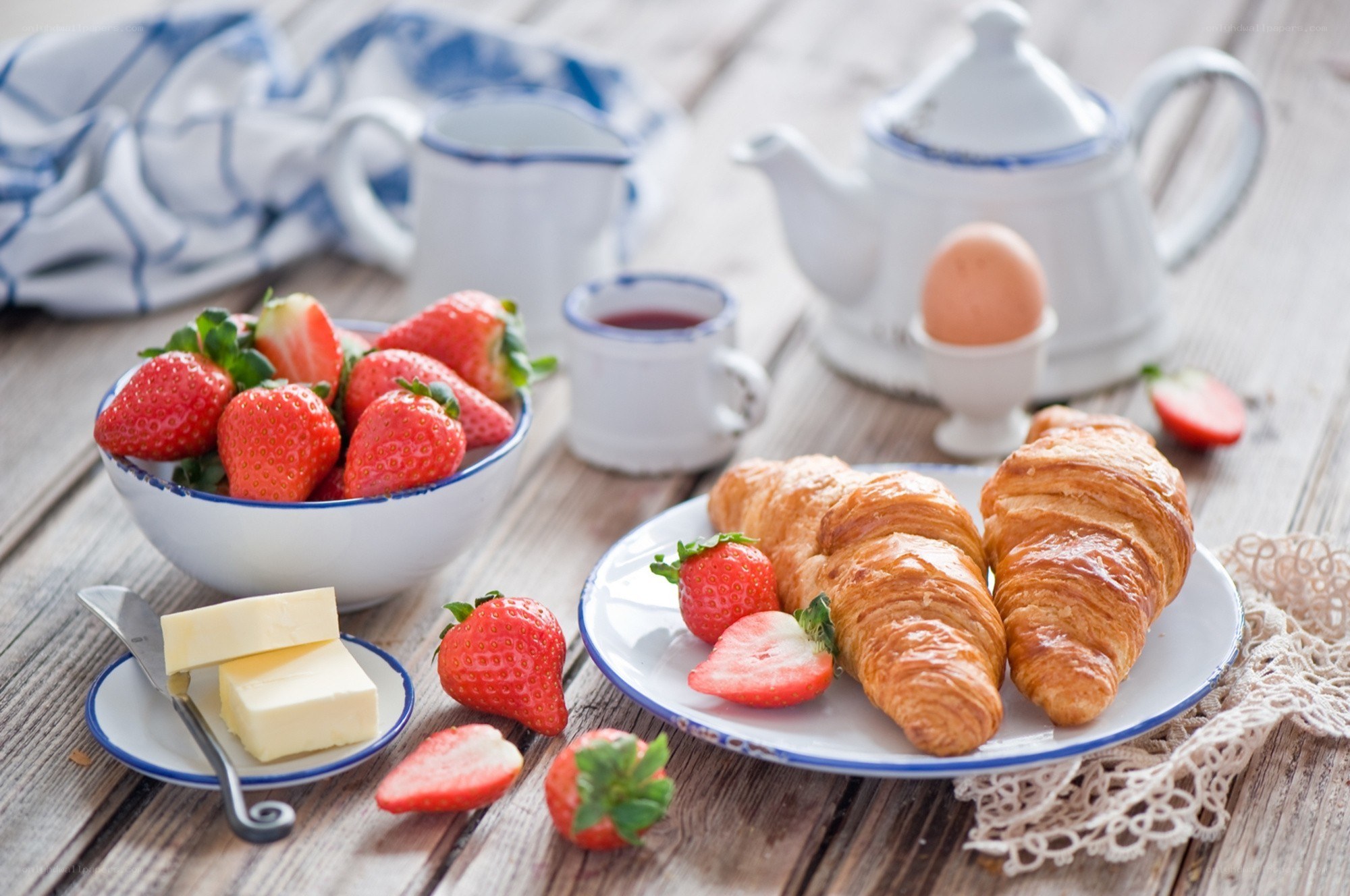 Breakfast with croissants and strawberries
