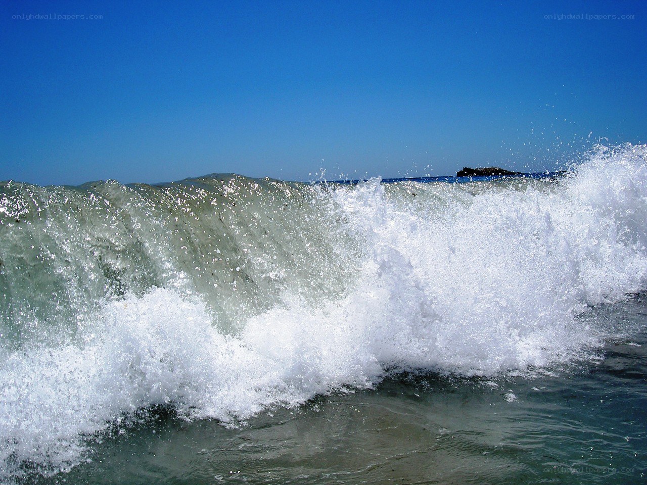 Breaking wave on a sunny day