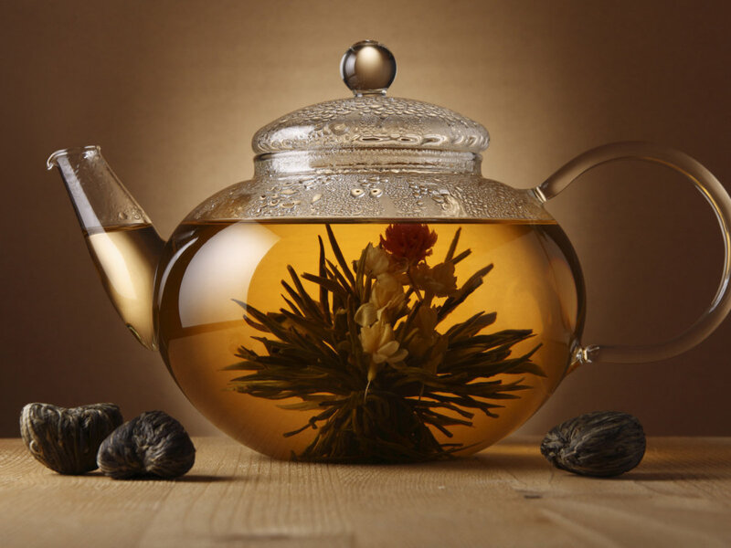 Brewing blooming tea in a glass teapot