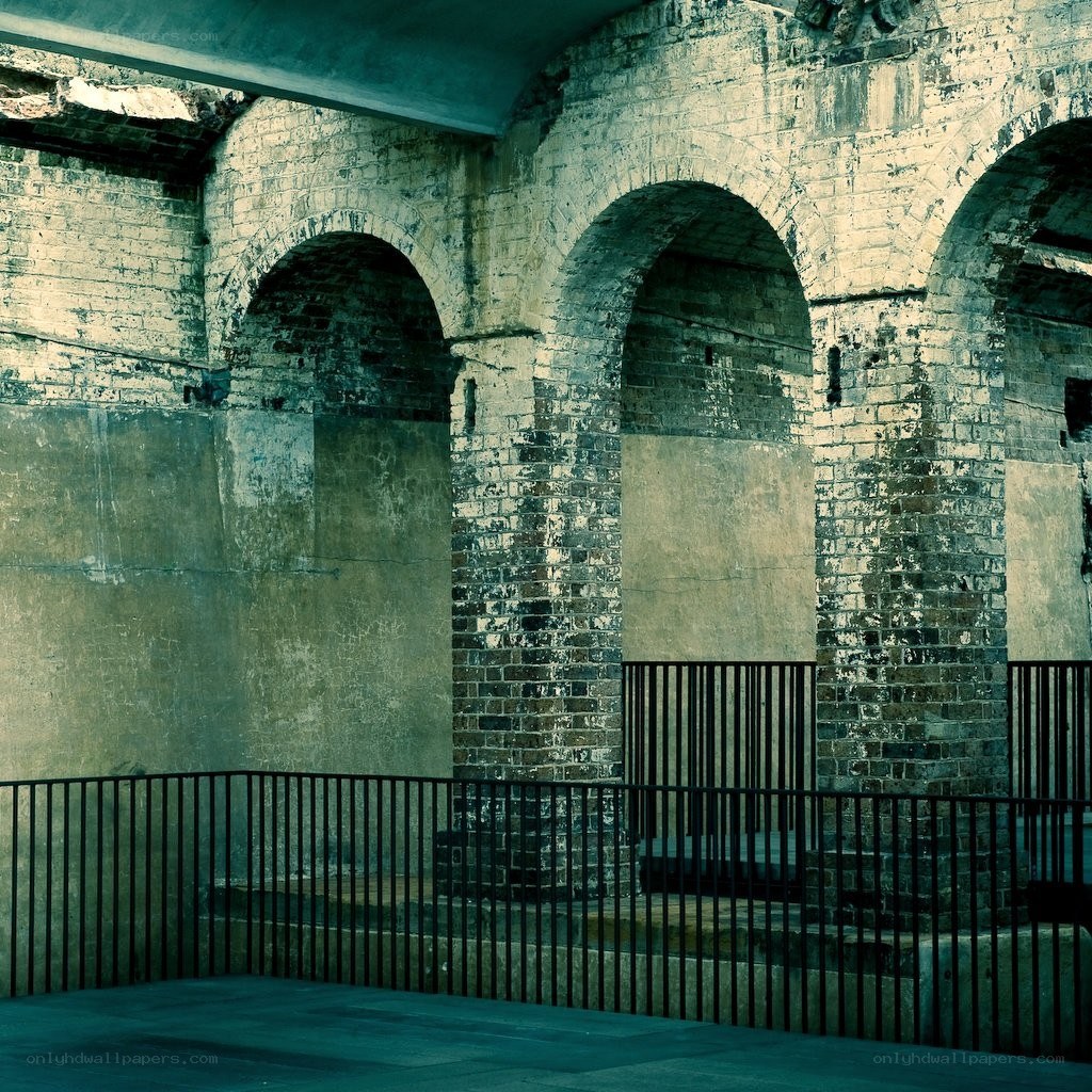 Brick arches under a bridge