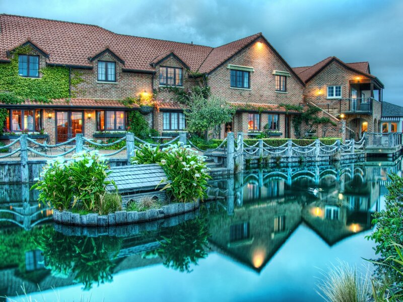 Brick building by a pond