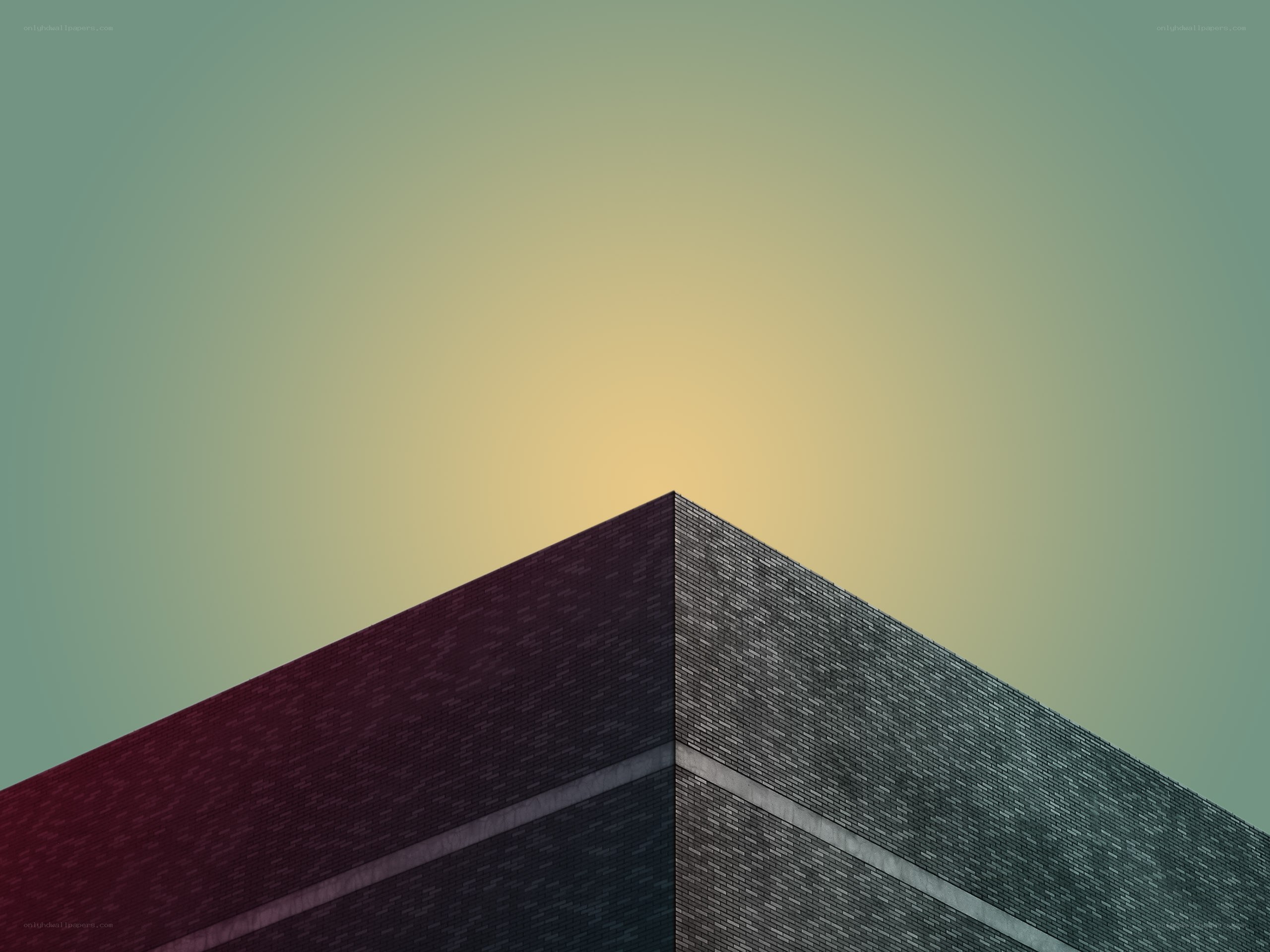 Brick building corner against sky