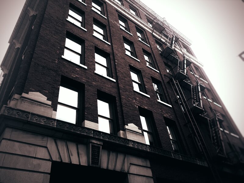 Brick Building Facade — Brown, Dramatic