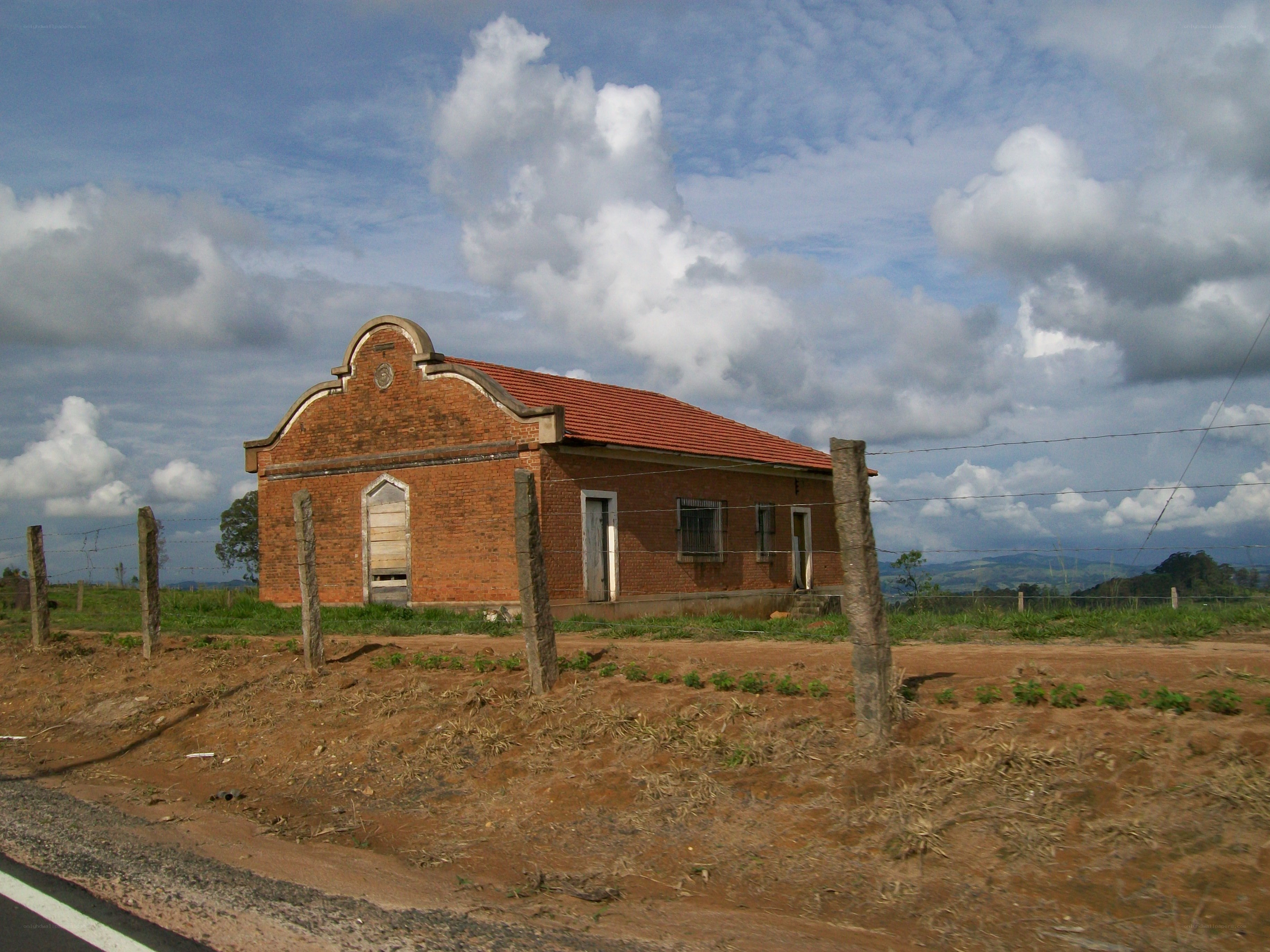 Brick building in rural landscape