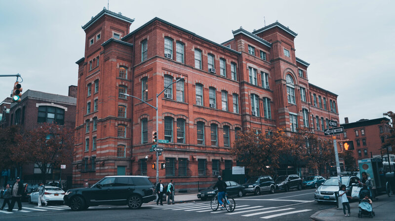 Brick Building on Street — Red