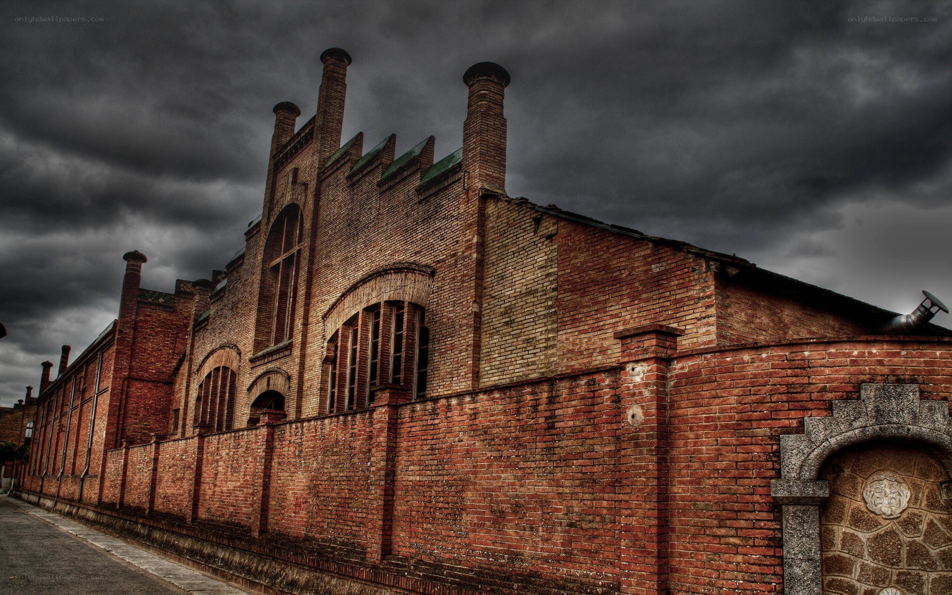 Brick building under stormy sky