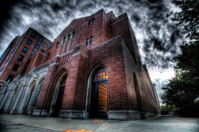 Brick building under stormy sky