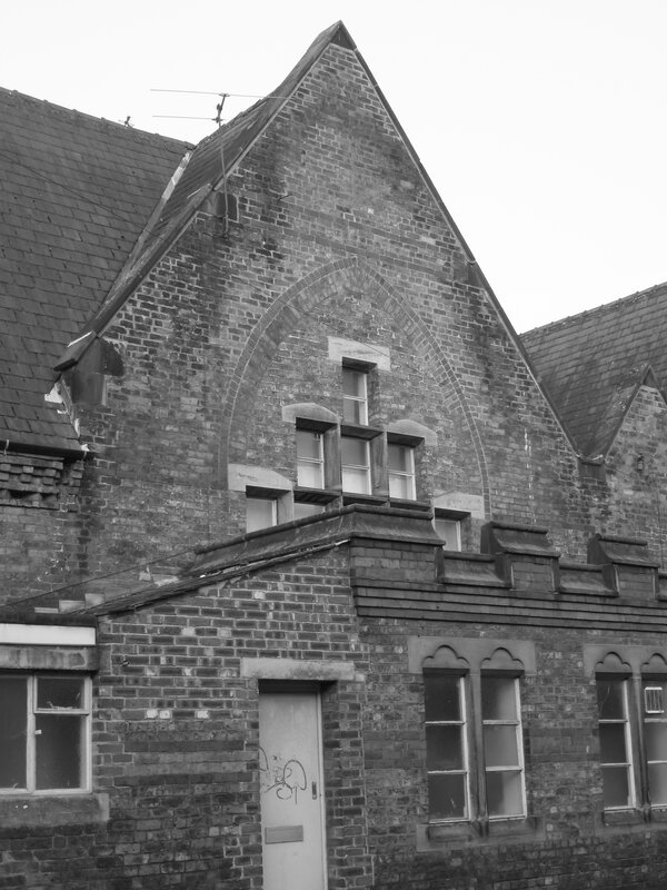 brick building with arched window