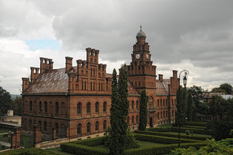 Brick Building with Clock Tower — Brown