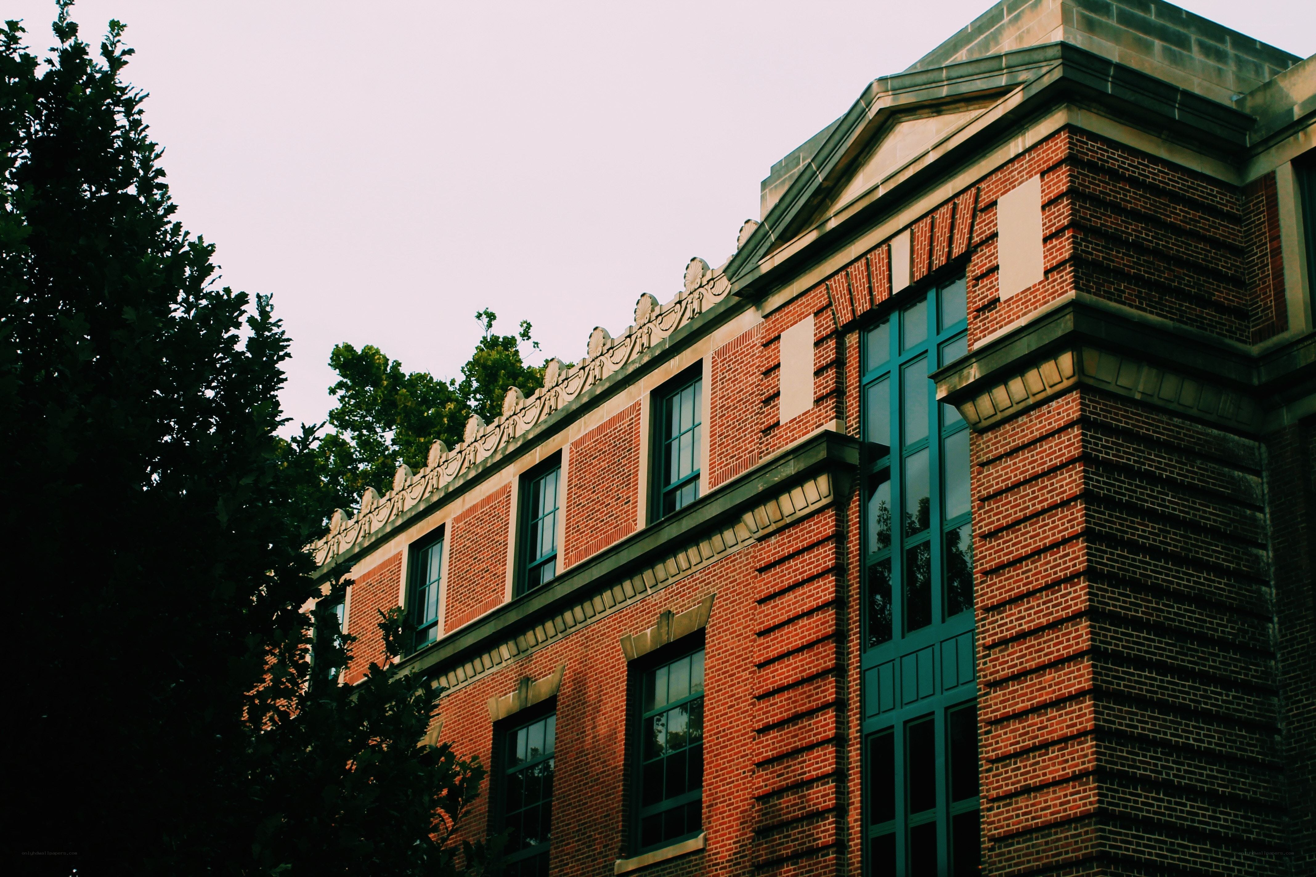 Brick building with green windows