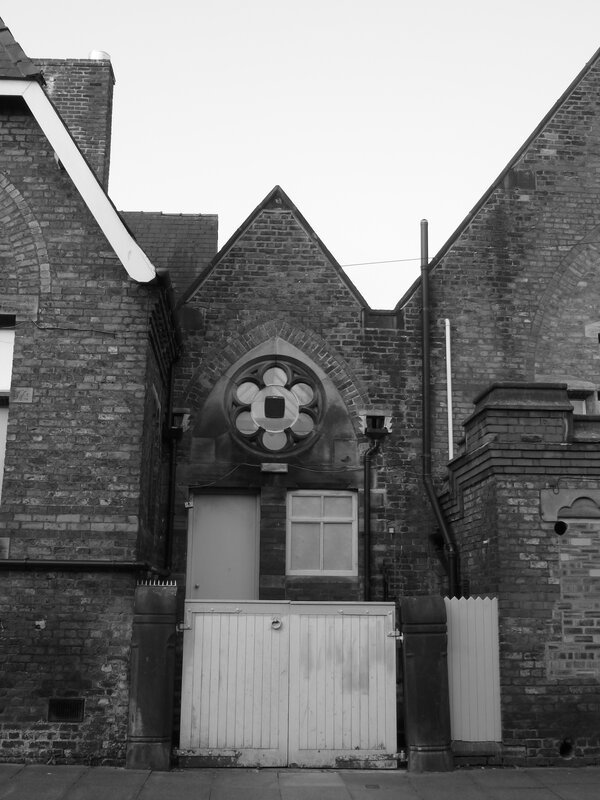 Brick Building with Rose Window — Black