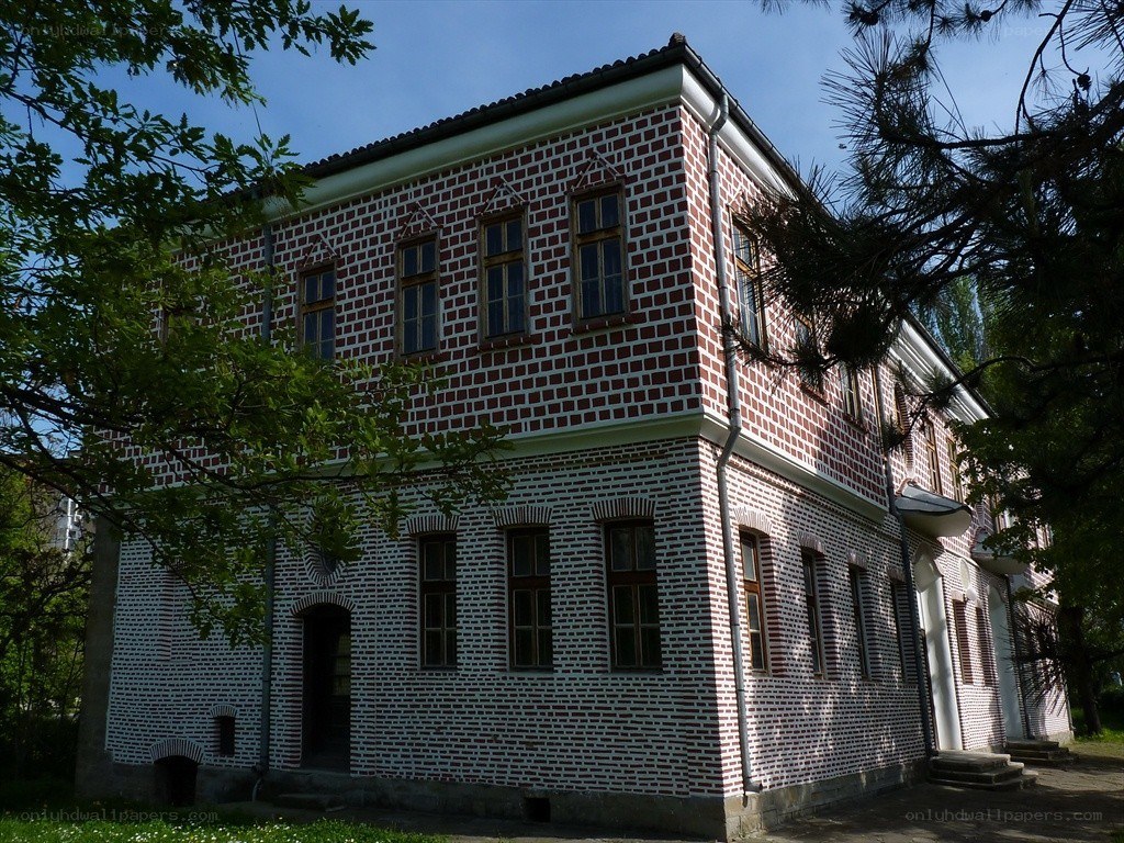 Brick building with text on walls