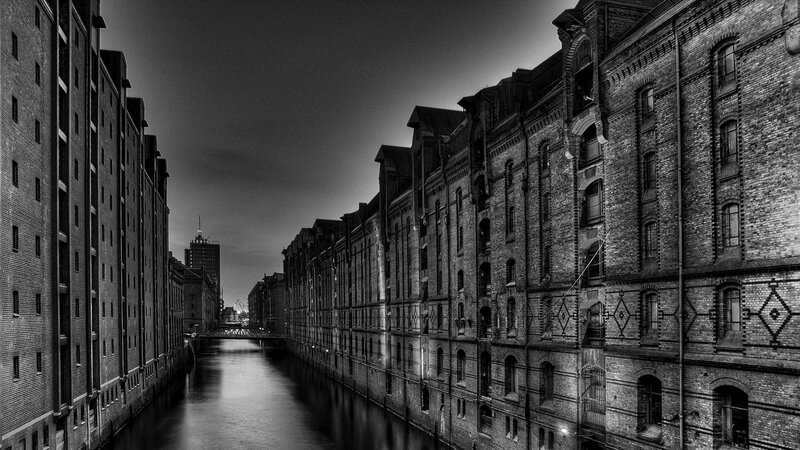 Brick Buildings Along Canal — Black, Dramatic, Night