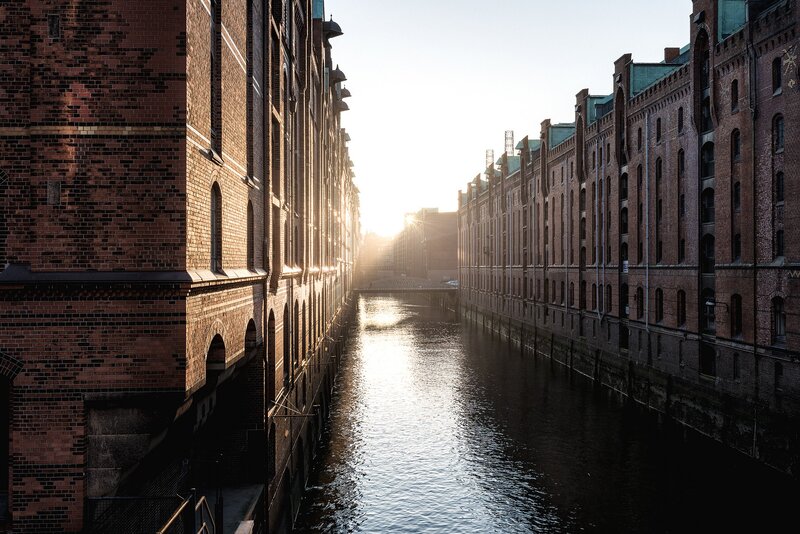 Brick Buildings Along Canal — Brown, Serene