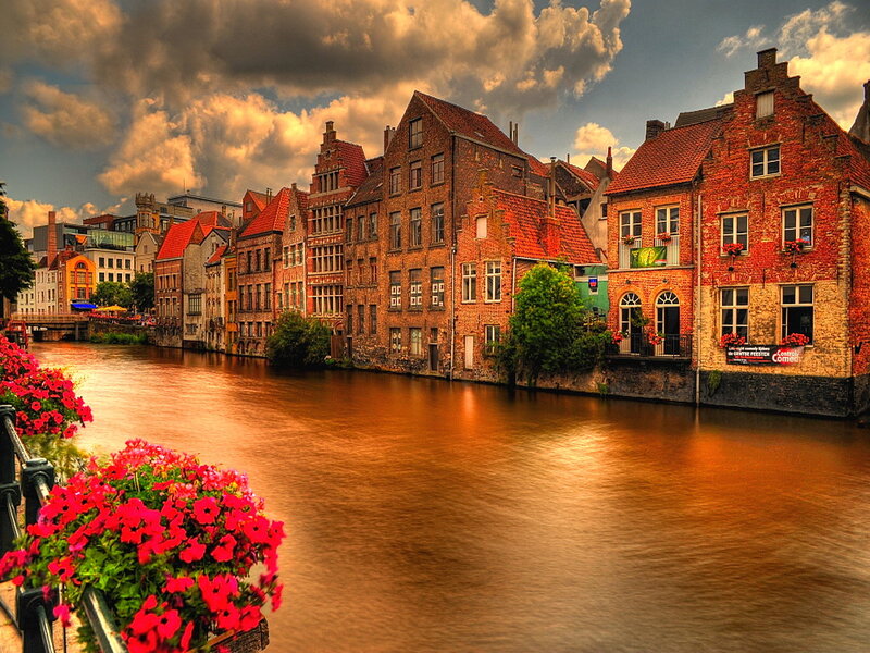 Brick Buildings Along Canal — Red
