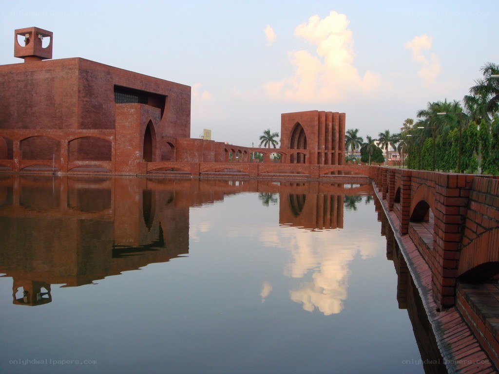Brick buildings reflected in water