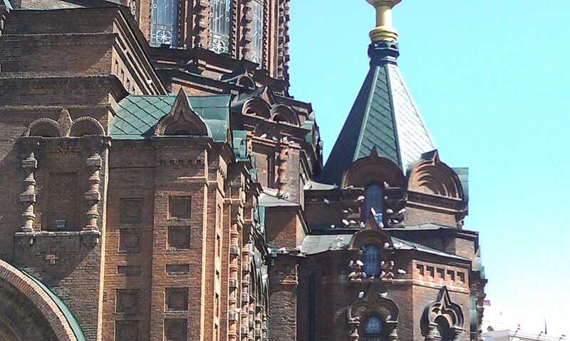 brick church with green domes