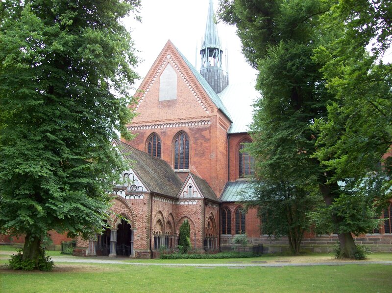 Brick church with green trees