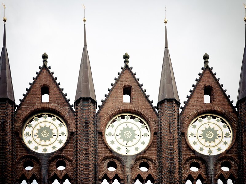 Brick church with star clocks