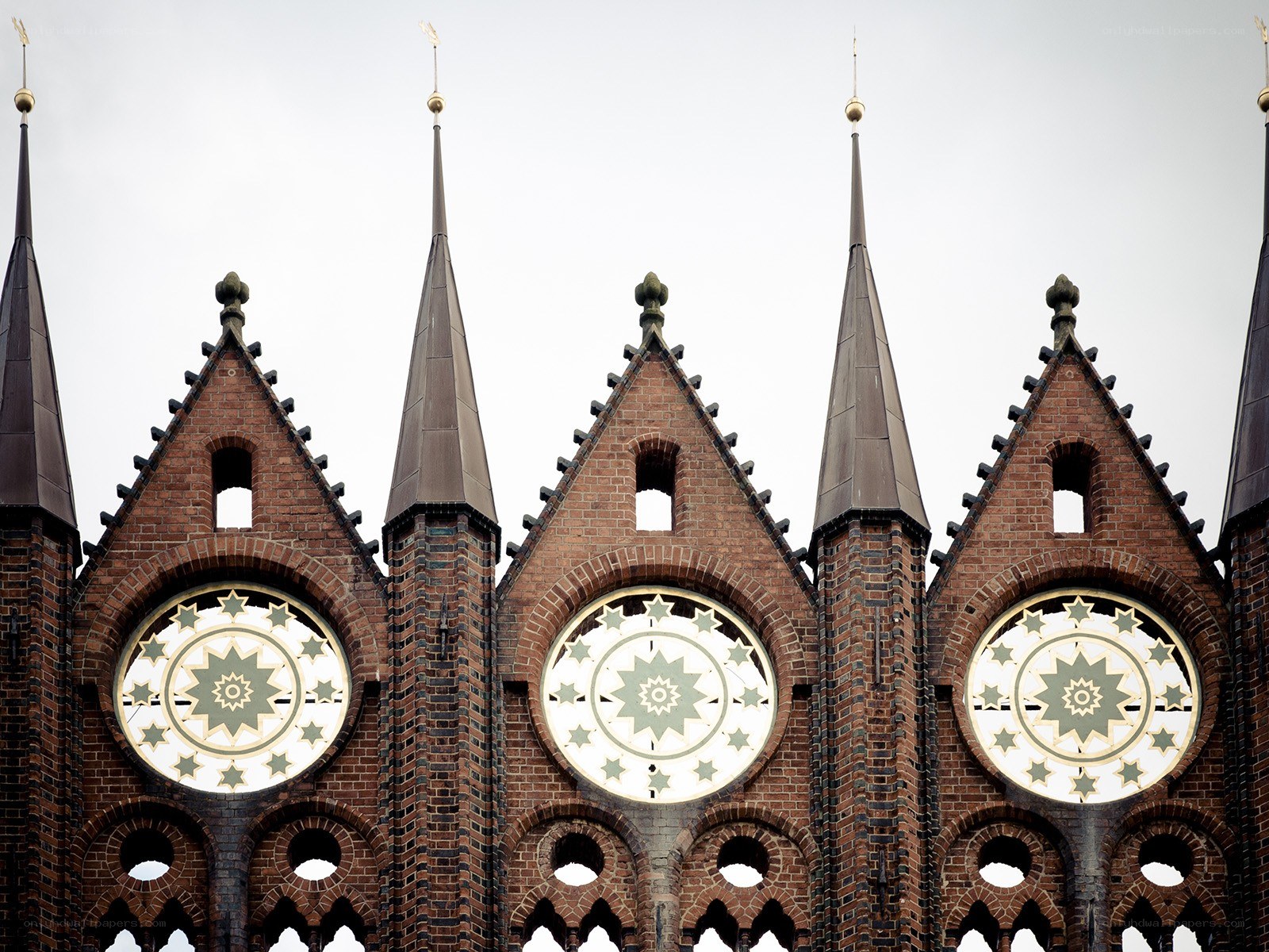 Brick church with star clocks