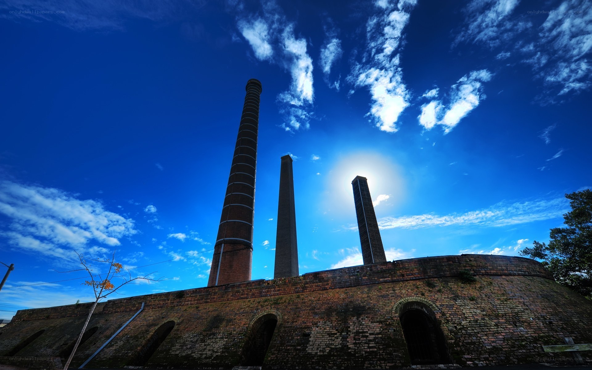 Brick factory with tall chimneys