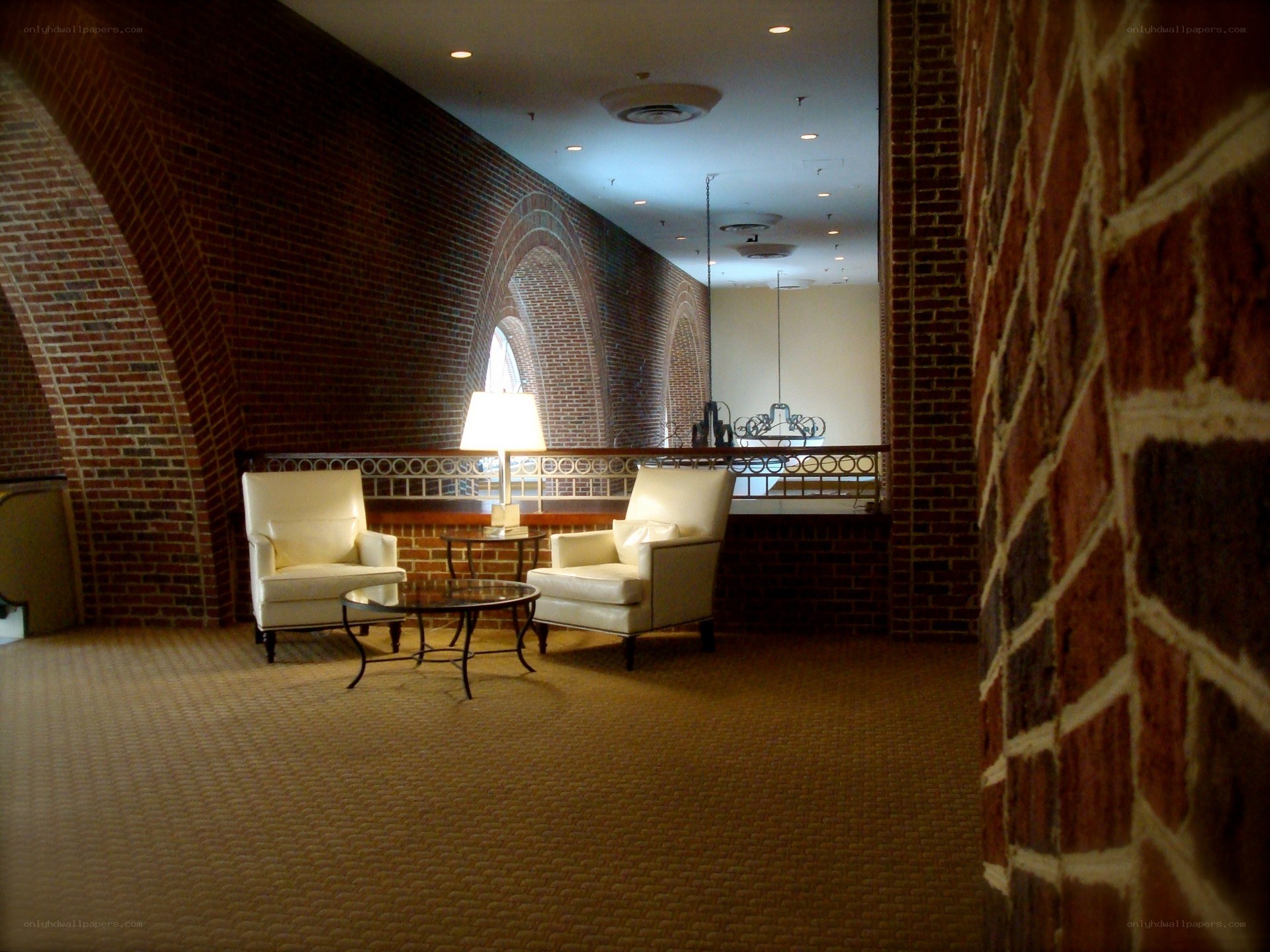 Brick hallway with seating area