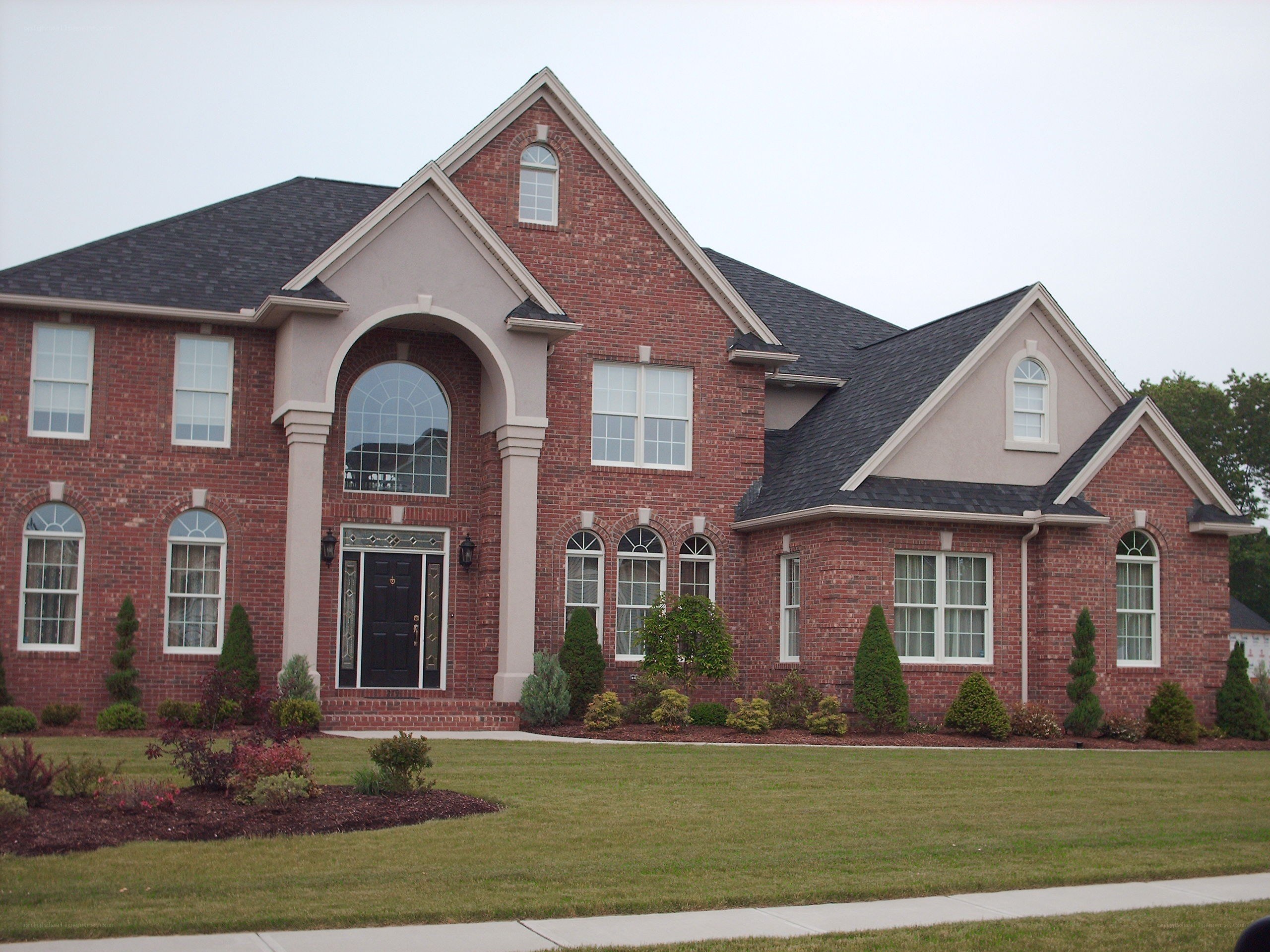 brick house with arched entry