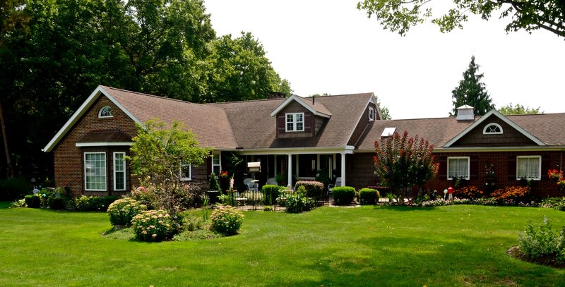 Brick House with Garden — Green, Serene, Afternoon, Photograph